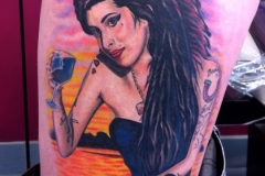 Woman Thigh Tattoo