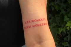 Roman Numerals Arm Tattoo