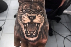Lion hand tattoo