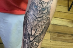 Geometric owl tattoo design
