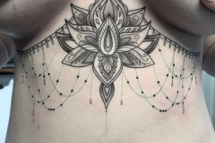 Sternum lotus tattoo